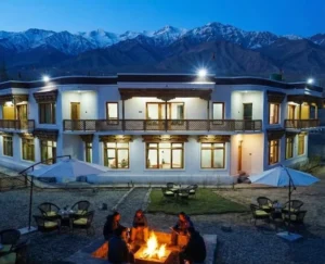 Cozy hotel summer inn ladakh with mountain backdrop.